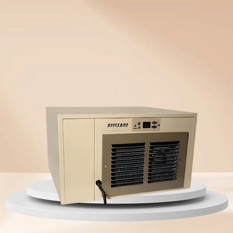 Breezaire WKCE Series compact wine cellar cooling unit Collection with front grille and control panel displayed on a clean warm-tone studio platform.