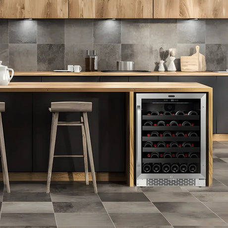 Built-in wine cooler with stainless frame and glass door storing multiple bottles, integrated into a modern kitchen island setting.
