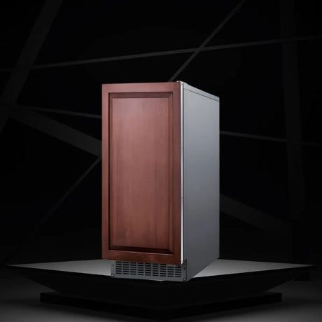 Outdoor built-in ice maker with panel-ready wood door and stainless steel cabinet for outdoor kitchen installation