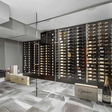 Self-contained through-the-wall wine cellar cooling unit installed above wall-mounted racks in a modern glass wine cellar