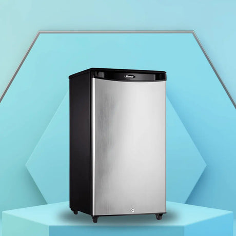 Standard depth stainless steel refrigerator with a compact upright design, shown on a modern display platform for home or commercial use