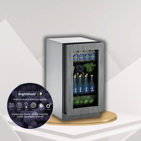 U-Line undercounter refrigerator with glass door and BrightShield antimicrobial protection displaying beverages and fresh food storage