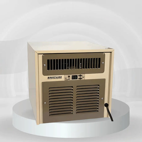 Compact Breezaire wine cellar cooling unit for cellars under 500 cu. ft., featuring dual front grilles and digital controls on a studio platform.